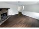 Open living room featuring a stone fireplace and hardwood floors at 5942 Rock Court #5, Union City, GA 30291