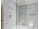 Walk-in shower with marble tile and glass enclosure at 2660 Peachtree Nw Rd # 4E, Atlanta, GA 30305