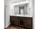 Bathroom with double sink vanity and wooden cabinets at 3270 Forest Green Dr, Douglasville, GA 30135