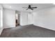 Spacious bedroom features neutral walls, soft carpet, and a ceiling fan at 3270 Forest Green Dr, Douglasville, GA 30135
