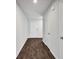 Hallway featuring sleek floors, neutral walls, and access to various rooms throughout the home at 3270 Forest Green Dr, Douglasville, GA 30135