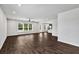 Bright living room showcasing sleek floors, natural light, and open layout into the kitchen at 3270 Forest Green Dr, Douglasville, GA 30135