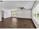 Open-concept living room features abundant natural light, ceiling fan, and neutral paint at 3270 Forest Green Dr, Douglasville, GA 30135
