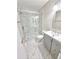 This bathroom has a glass enclosed shower, toilet, vanity, and tiled floor at 1177 Church St # F, Decatur, GA 30030