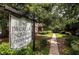 Decatur Square Condominiums sign surrounded by lush greenery and mature trees at 1177 Church St # F, Decatur, GA 30030