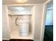This is a laundry closet with a washing machine and shelving at 1177 Church St # F, Decatur, GA 30030
