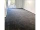 Living room featuring neutral walls and carpeting and access to outdoor space at 1177 Church St # F, Decatur, GA 30030