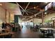 Industrial-style brewery with high ceilings, exposed ducts, and large tables at 1134 Donnelly Sw Ave, Atlanta, GA 30310