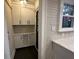 White shaker cabinets, wine rack, and quartz countertops in a butlers pantry at 1134 Donnelly Sw Ave, Atlanta, GA 30310