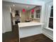 Sleek kitchen featuring white cabinets, quartz countertops, and a breakfast bar at 1134 Donnelly Sw Ave, Atlanta, GA 30310