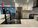 Modern kitchen with stainless steel appliances and a large island with seating at 1134 Donnelly Sw Ave, Atlanta, GA 30310