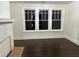 Living room features hardwood floors and a white brick fireplace at 1134 Donnelly Sw Ave, Atlanta, GA 30310