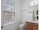 Simple bathroom with light wood vanity and large window at 2853 Brandl Cove Ct # 1, Marietta, GA 30067