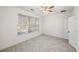 Bright bedroom with large window, ceiling fan, and light gray vinyl flooring at 2853 Brandl Cove Ct # 1, Marietta, GA 30067