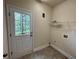 Laundry room with exterior access and overhead shelving at 2853 Brandl Cove Ct # 1, Marietta, GA 30067