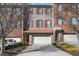 Front view of brick townhouse with a double car garage at 2853 Brandl Cove Ct # 1, Marietta, GA 30067