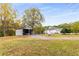 Home with detached garage and large yard at 1553 Alcovy Rd, Lawrenceville, GA 30045