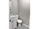 Bathroom with white fixtures and patterned tile floor at 6185 Bermuda St, Forest Park, GA 30297