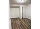 Bright bedroom boasts hardwood floors and ample closet space at 6185 Bermuda St, Forest Park, GA 30297