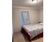 Cozy bedroom includes a window with curtains at 6185 Bermuda St, Forest Park, GA 30297