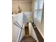 Stairway to basement with wood plank shelf and carpeted steps at 6185 Bermuda St, Forest Park, GA 30297