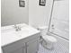 Bathroom with gray vanity, hexagon tile floor and a tub at 2961 Hawk Se Ct, Marietta, GA 30067