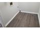 Laundry room with wood-look vinyl flooring at 2961 Hawk Se Ct, Marietta, GA 30067