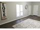 Living room with dark hardwood floors and a large area rug at 2961 Hawk Se Ct, Marietta, GA 30067