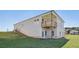Exterior view shows the home's backyard, deck, and the home's gray siding at 24 Dew Lake Ct, Grayson, GA 30017