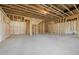 Expansive unfinished basement featuring concrete floor, framed walls, and ceiling at 24 Dew Lake Ct, Grayson, GA 30017