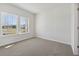 Bright bedroom featuring carpet and two windows with an outdoor view at 24 Dew Lake Ct, Grayson, GA 30017