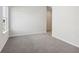 This bright bedroom has soft carpet and a window overlooking the yard at 24 Dew Lake Ct, Grayson, GA 30017
