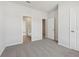 Comfortable bedroom with carpet, neutral walls, and an attached bath at 24 Dew Lake Ct, Grayson, GA 30017
