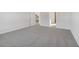 Spacious bedroom featuring neutral carpeting and a view into other rooms at 24 Dew Lake Ct, Grayson, GA 30017
