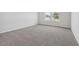 Comfortable bedroom with plush carpeting and double windows offering natural light at 24 Dew Lake Ct, Grayson, GA 30017