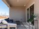 Inviting outdoor patio with comfortable seating and a view of the surrounding landscape at 24 Dew Lake Ct, Grayson, GA 30017