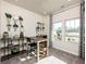 Versatile flex room with a desk, shelving, and large windows overlooking the outdoors at 24 Dew Lake Ct, Grayson, GA 30017