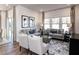 Cozy living room featuring comfortable seating, stylish decor, and ample natural light at 24 Dew Lake Ct, Grayson, GA 30017