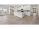 Open-concept living area with hardwood floors and a kitchen island perfect for entertaining at 24 Dew Lake Ct, Grayson, GA 30017