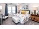 Bright main bedroom with a plush bed, tasteful furnishings, and plenty of natural light at 24 Dew Lake Ct, Grayson, GA 30017