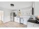 Modern kitchen with white shaker cabinets, stainless steel appliances, and a kitchen island at 2746 King Arthur Ct, Buford, GA 30519