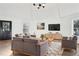 Bright living room featuring hardwood floors and stylish furniture at 2746 King Arthur Ct, Buford, GA 30519