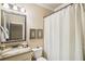 Small bathroom with shower/tub combo and granite countertop at 320 Town Center Ave # U206B, Suwanee, GA 30024