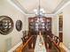 Formal dining room features a china cabinet and chandelier at 320 Town Center Ave # U206B, Suwanee, GA 30024