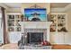 Elegant fireplace with built-in shelving and stone surround at 320 Town Center Ave # U206B, Suwanee, GA 30024