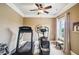 Home gym with treadmill and elliptical, providing a private workout space at 320 Town Center Ave # U206B, Suwanee, GA 30024