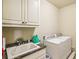 Convenient laundry room with washer, dryer, and utility sink at 320 Town Center Ave # U206B, Suwanee, GA 30024