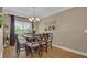 Bright dining room featuring a large table and hardwood floors at 1204 Glen Ivy # 12, Marietta, GA 30062