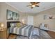 Main bedroom with hardwood floors, large window and ceiling fan at 1204 Glen Ivy # 12, Marietta, GA 30062