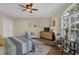 Main bedroom with hardwood floors, large window and ceiling fan at 1204 Glen Ivy # 12, Marietta, GA 30062